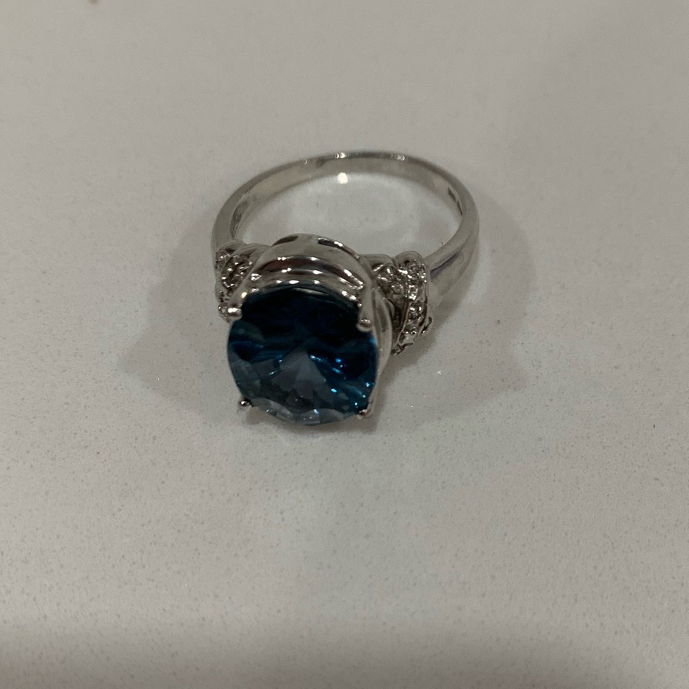 10k white gold ring with blue stone